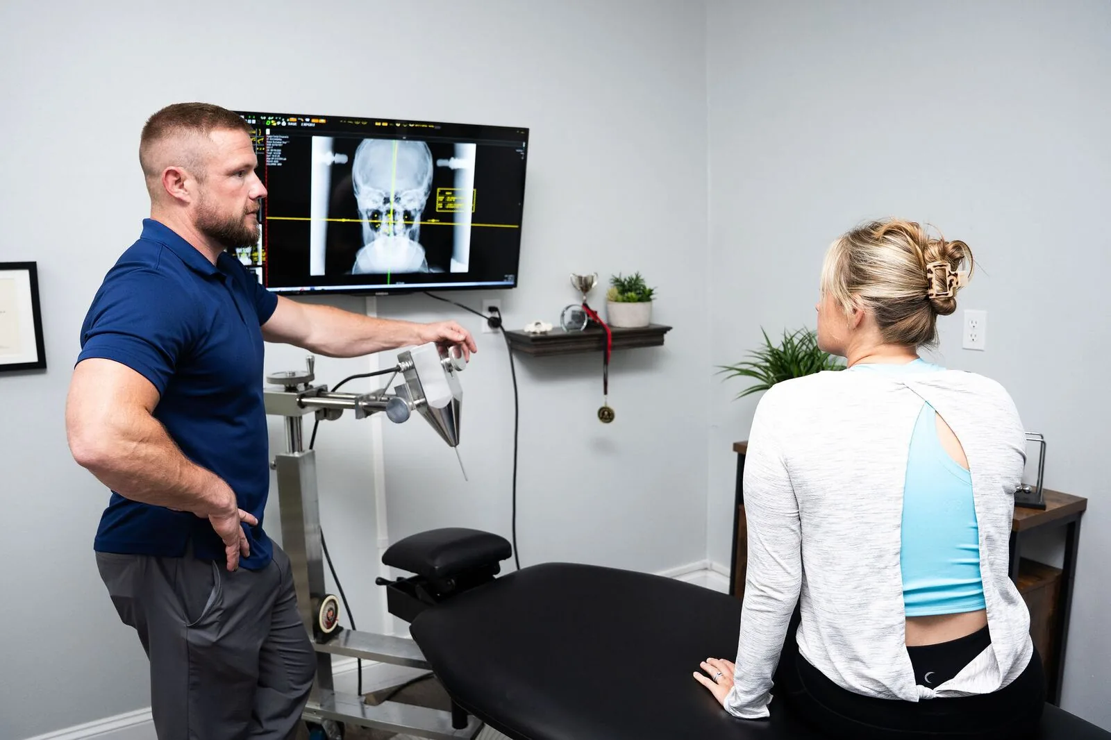 Dr. Max Orris consulting with a patient at Gateway Upper Cervical Institute